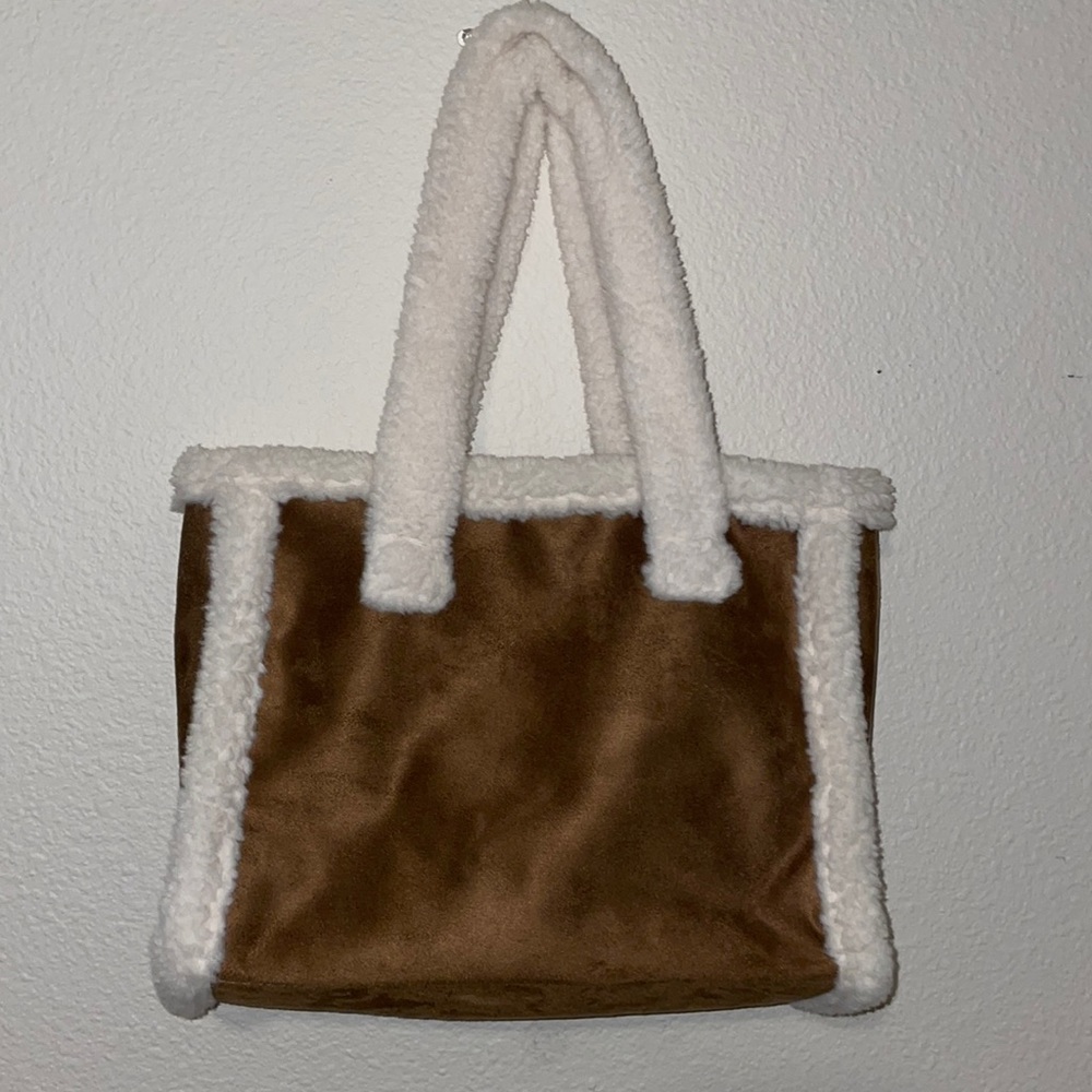Brown fuzzy purse/bag  comes with a black and gold wallet